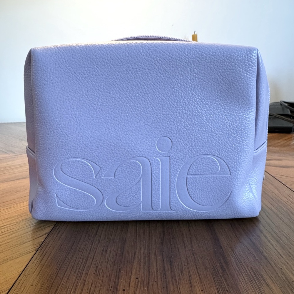 Saie Oversized Lilac Vegan Leather Makeup Bag.